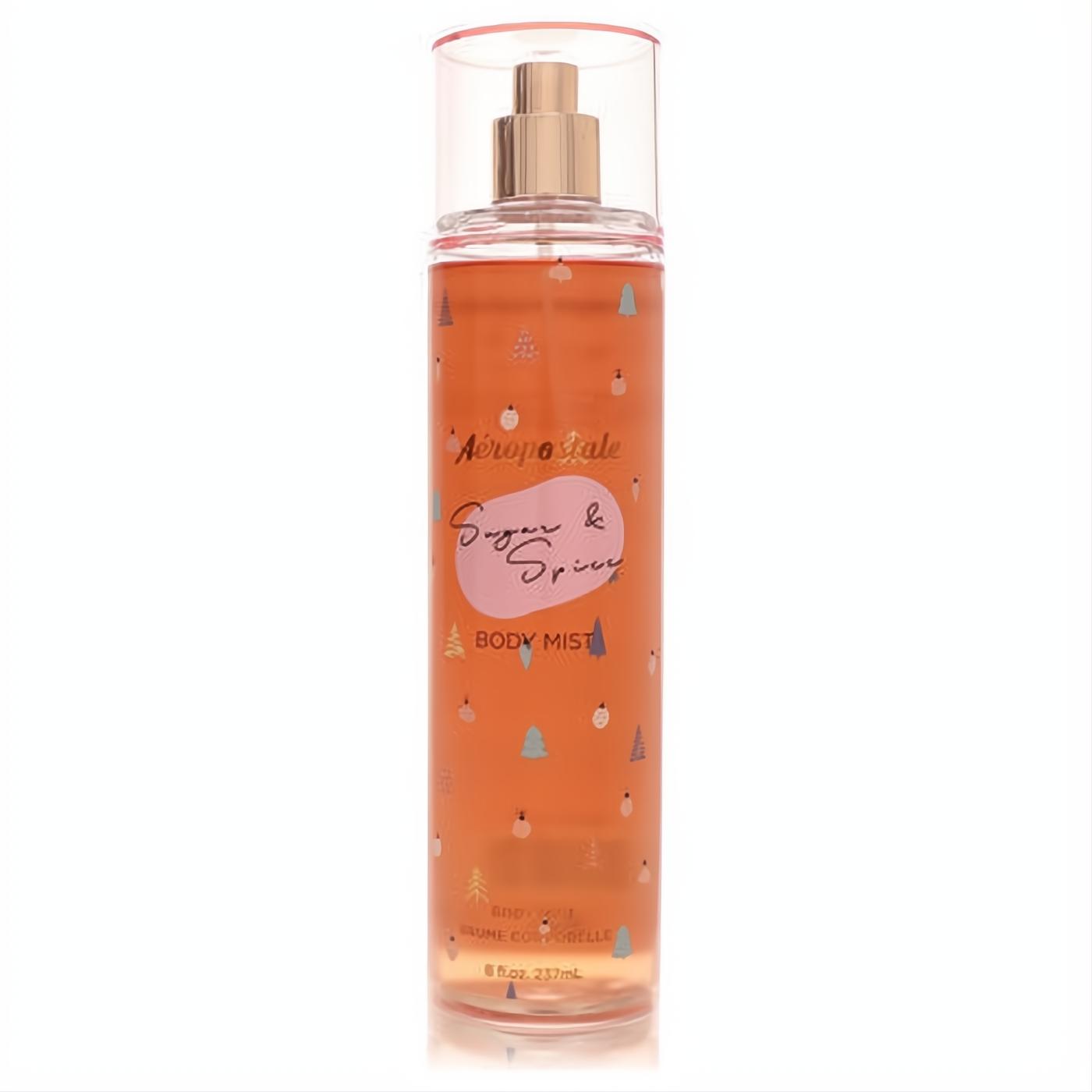 Aeropostale Sugar & Spice 8 oz body mist. Clear bottle, warm amber liquid, pink cap, and charming festive tree design.