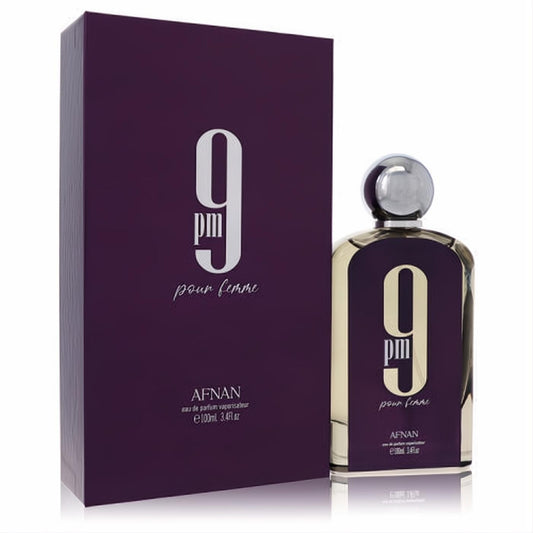 Sophisticated Afnan 9pm Pour Femme 3.4 oz EDP. Deep purple bottle with striking gold "9 pm" design, silver cap, and matching elegant box.