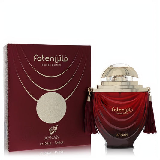 Captivating Afnan Faten Maroon 3.4 oz unisex eau de parfum. Rich maroon bottle, ornate gold cap, and elegant tassels.