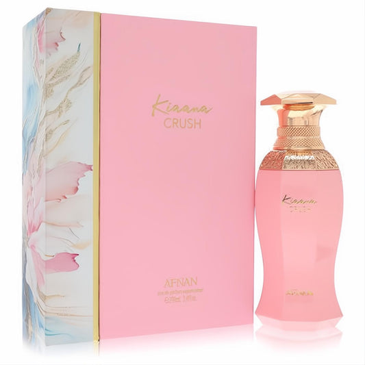 Afnan Kiaana Crush 3.4 oz women's perfume. Elegant pink faceted bottle with gold cap, beside a matching floral-accented gift box.