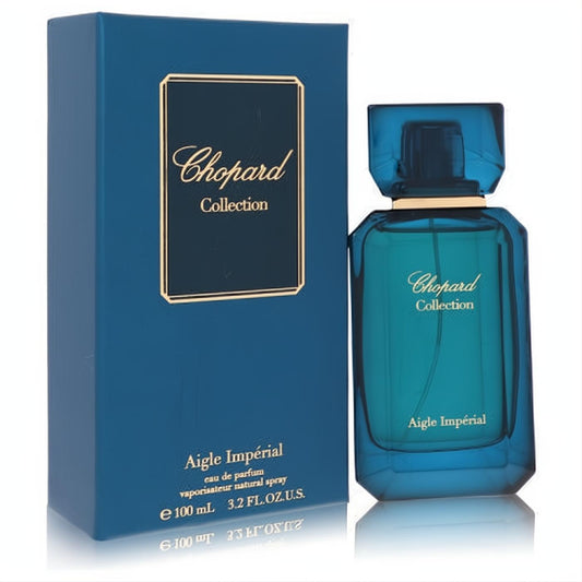 Elegant Chopard Aigle Impérial 3.2 oz unisex Eau de Parfum in a sleek teal glass bottle with gold details, displayed with its matching blue box.