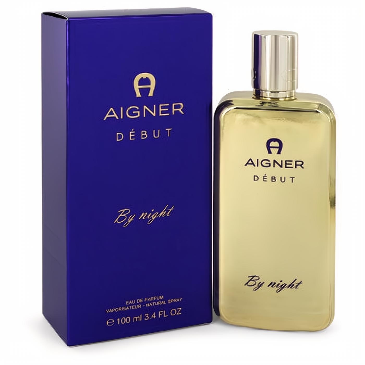 Elegant Aigner Debut By Night 3.4 oz gold perfume bottle with a sleek metallic cap, paired with a rich blue box.