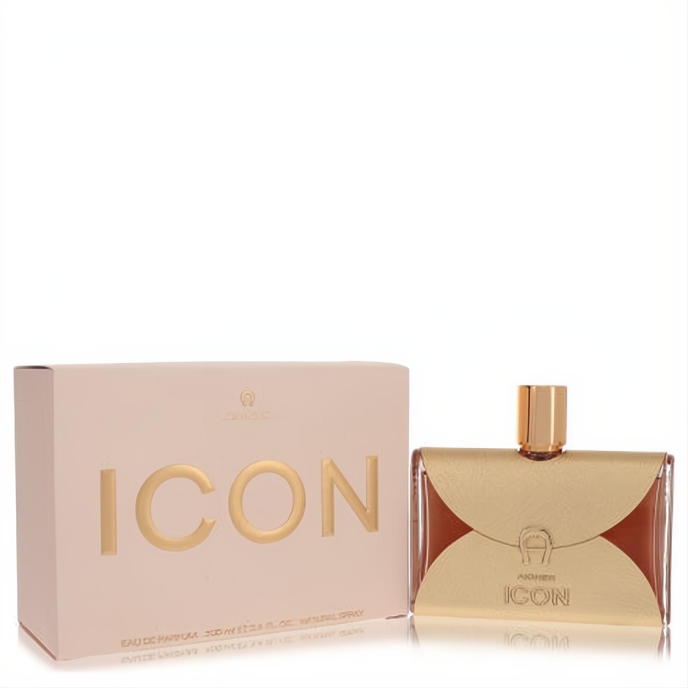 Aigner Icon 3.4 oz Eau de Parfum for women. Luxurious bottle with a distinctive gold metallic overlay, amber liquid, and elegant pink box.