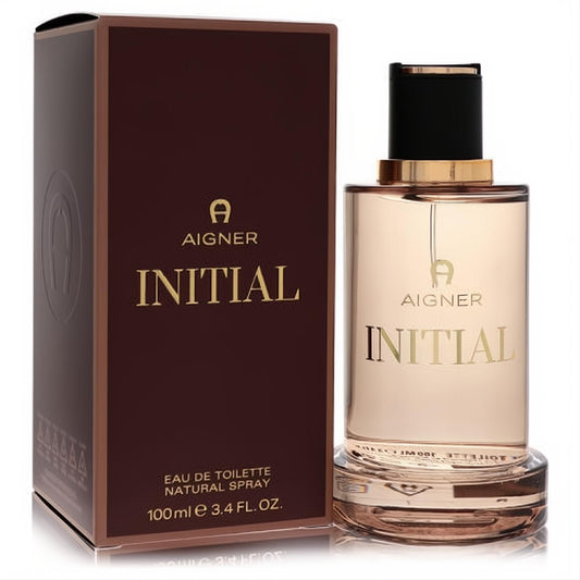 Sophisticated Aigner Initial men's Eau De Toilette 3.4 oz spray. Clear bottle, gold liquid, black cap, and rich brown box with gold branding.