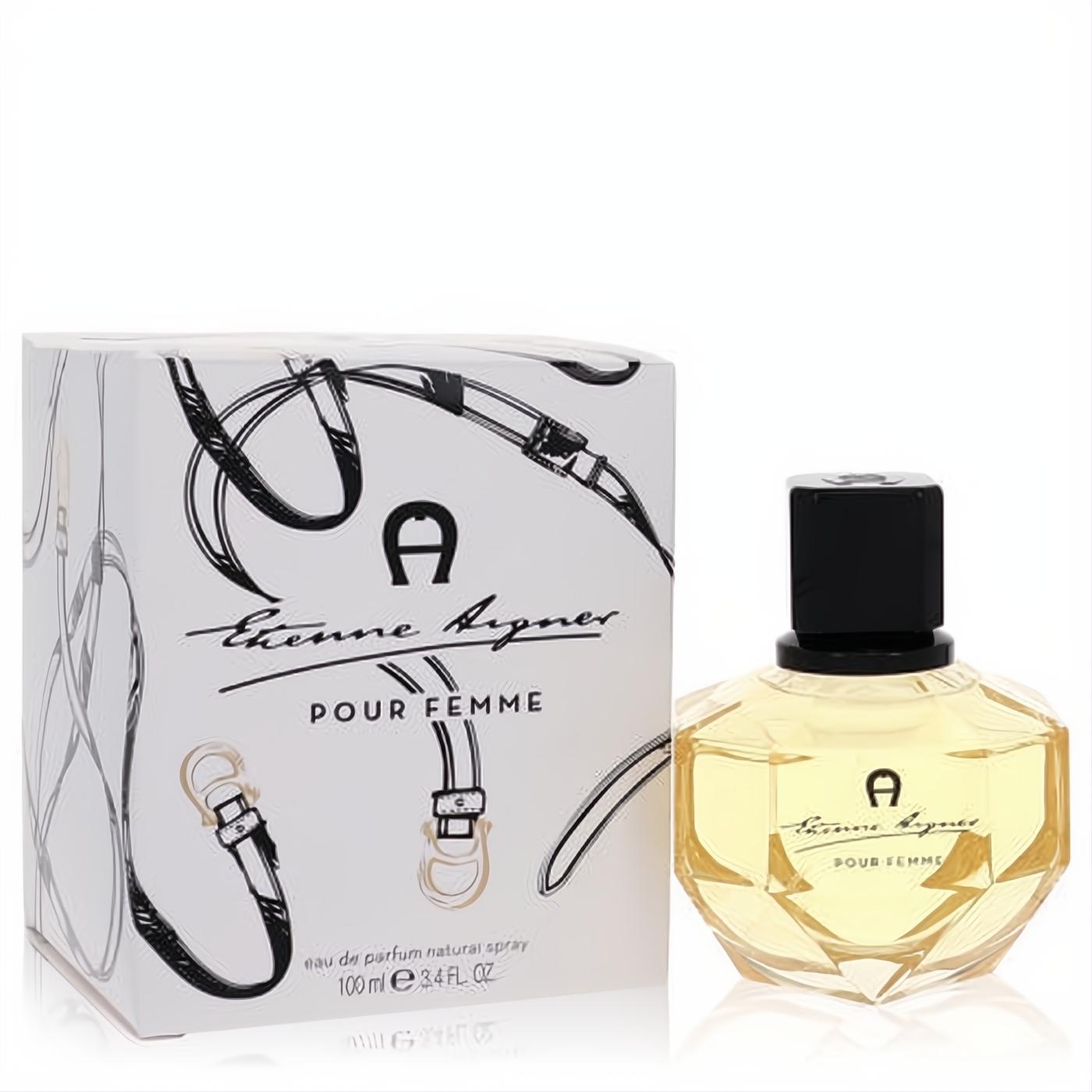 Distinctive Aigner Pour Femme 3.4 oz EDP spray. Features a faceted glass bottle with golden liquid and an elegant equestrian-designed white box.
