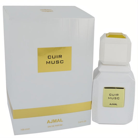 Ajmal Cuir Musc 3.4 oz unisex EDP. Modern white bottle with gold label and cap, next to its sleek matching white and gold box.