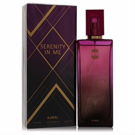 Ajmal Serenity In Me 3.4 oz EDP. Elegant magenta gradient glass bottle with gold details and a luxurious dark purple geometric box.