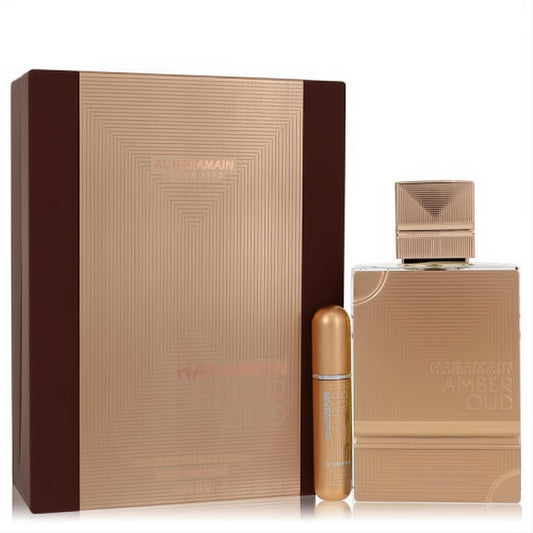 Elevate your scent with Al Haramain Amber Oud Gold Extreme gift set. Features a luxurious golden perfume, travel spray, and elegant geometric box.