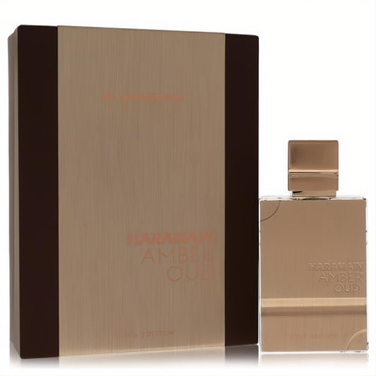 Luxurious Al Haramain Amber Oud Gold Edition 2 oz unisex perfume bottle and sleek gold box, exuding sophistication.