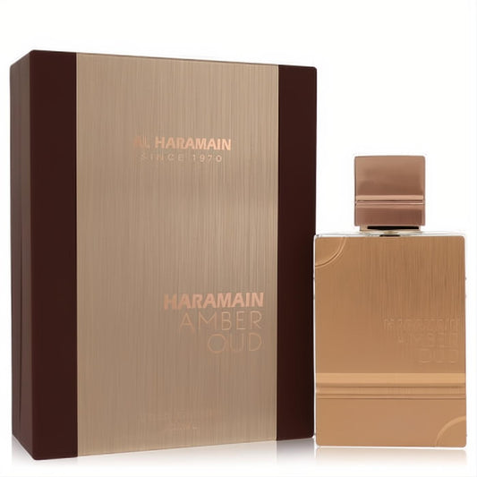 Luxurious Al Haramain Amber Oud Gold Edition perfume in a sleek, brushed gold bottle with a matching brown and gold branded box.