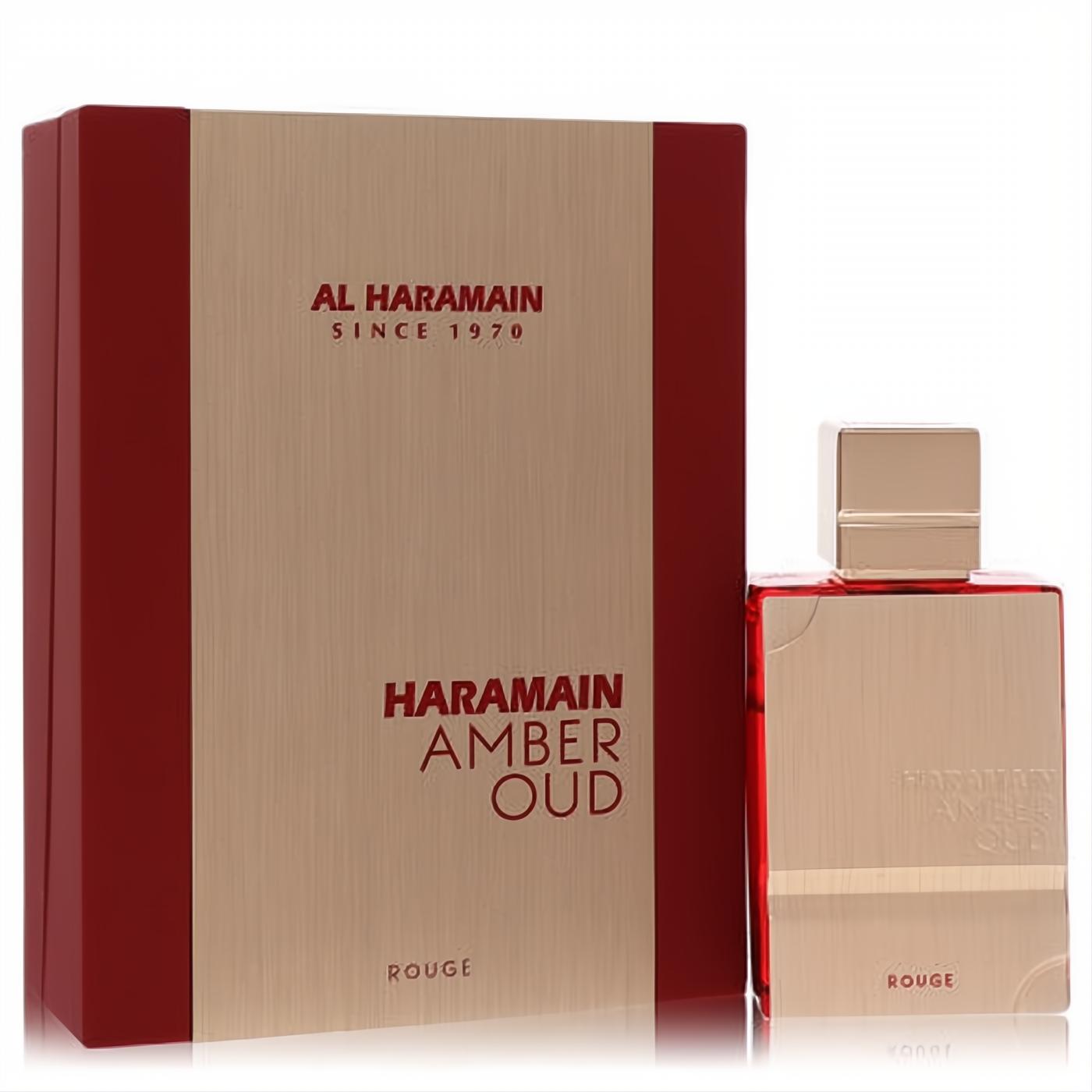 Luxurious Al Haramain Amber Oud Rouge 2 oz EDP. Sleek rose gold bottle with red liquid, alongside its elegant red and metallic gold box.