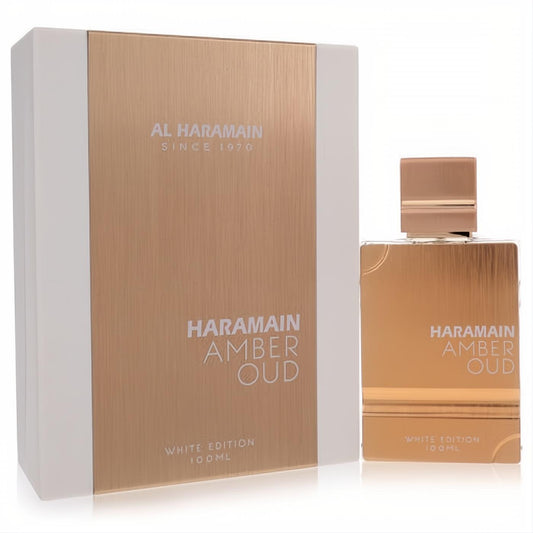 Al Haramain Amber Oud White Edition 100ml unisex eau de parfum spray. Elegant golden-hued bottle and box with crisp white accents.