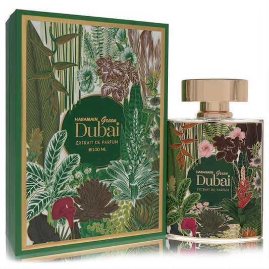 Al Haramain Green Dubai Extrait De Parfum, 3.3 oz, features a vibrant tropical leaf design on its bottle and box with a luxurious gold cap.