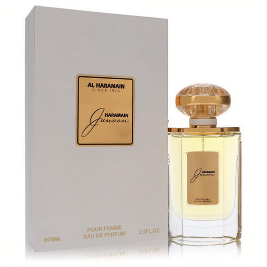 Al Haramain Junoon 2.5 oz EDP for women. Clear glass bottle with light amber liquid, ornate gold cap, and elegant white box.