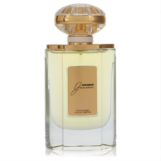 Captivating Al Haramain Junoon women's EDP. Clear glass bottle with gold liquid, gold label, and ornate clear & gold cap.