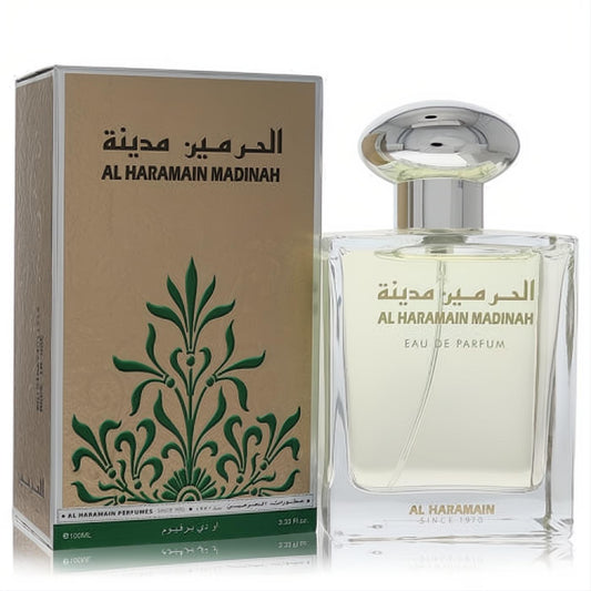 Al Haramain Madinah 3.33 oz unisex EDP. Clear glass bottle, sleek silver cap, and elegant tan box with green Arabic design.