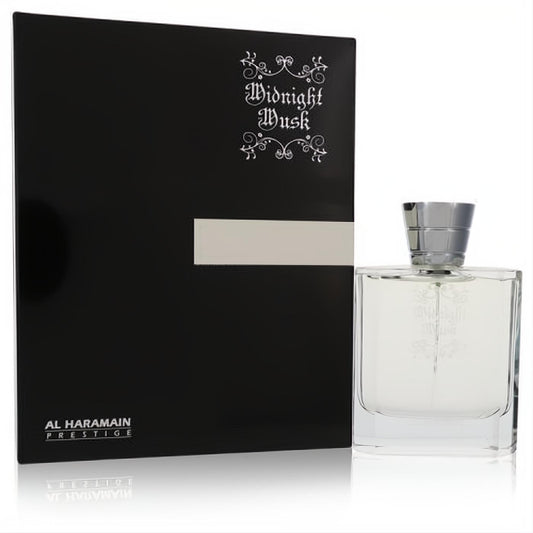 Al Haramain Midnight Musk 3.4 oz unisex EDP. Sleek clear glass bottle with silver cap, next to its elegant black and silver box.