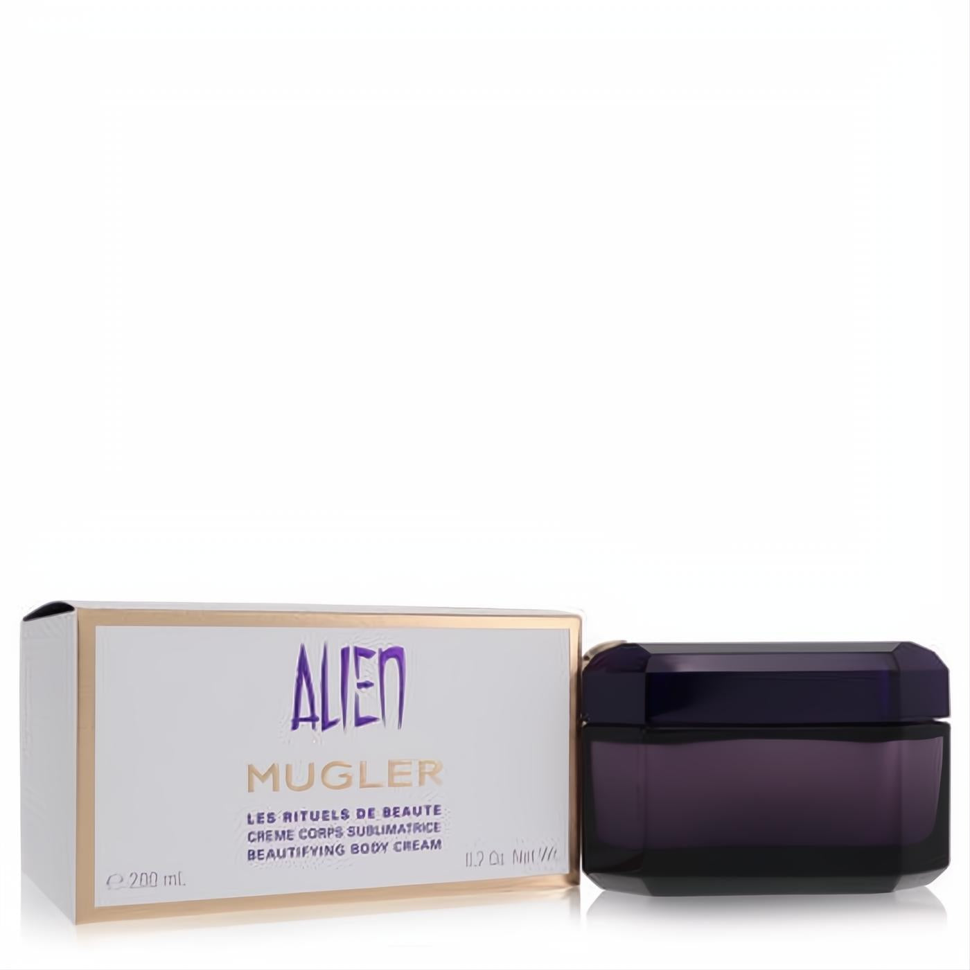 Indulge with Alien by Thierry Mugler Beautifying Body Cream. Luxurious dark purple faceted jar and elegant gold-accented box.