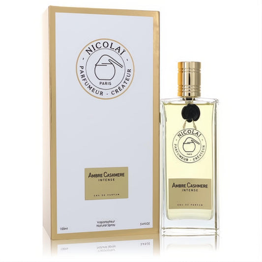 Experience Nicolai Ambre Cashmere Intense 3.4 oz unisex EDP. Elegant clear bottle with gold cap and white box.