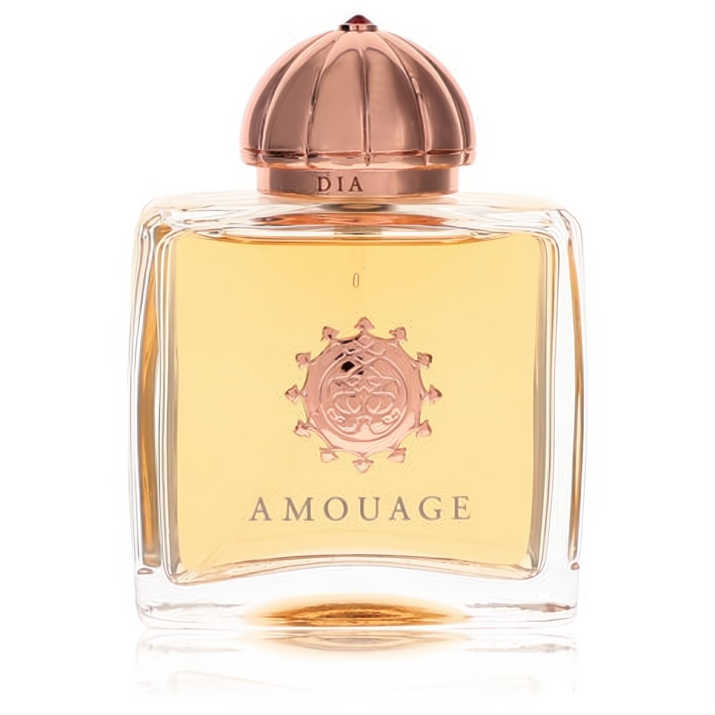Amouage Dia women's EDP: clear glass bottle, golden fragrance, elegant rose gold ribbed cap with red jewel and emblem.