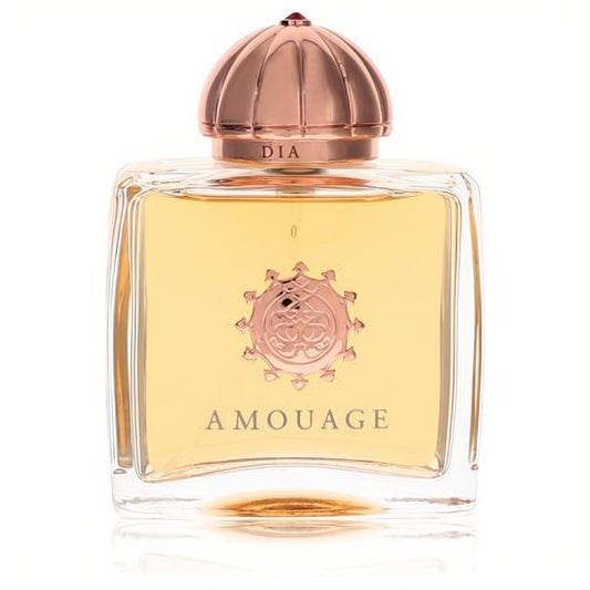 Amouage Dia women's EDP: clear glass bottle, golden fragrance, elegant rose gold ribbed cap with red jewel and emblem.