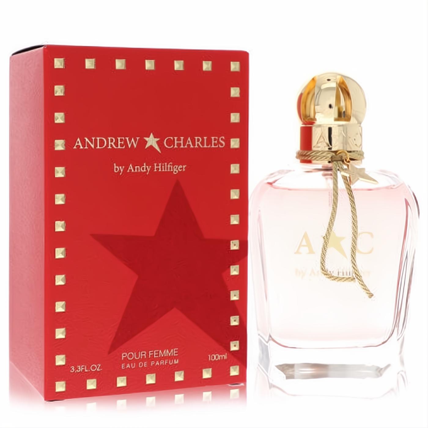 Andrew Charles by Andy Hilfiger 3.3 oz perfume. Bold red studded box, elegant pink glass bottle with gold cap, star charm, and 'A C' logo.