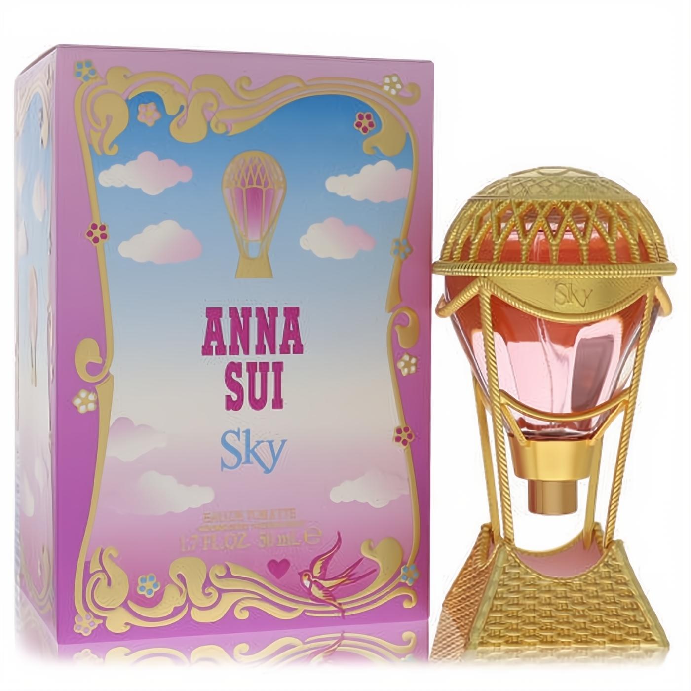 Anna Sui Sky 1.7 oz EDT. Captivating pink hot air balloon bottle with intricate gold details, beside its dreamy pink cloud box.