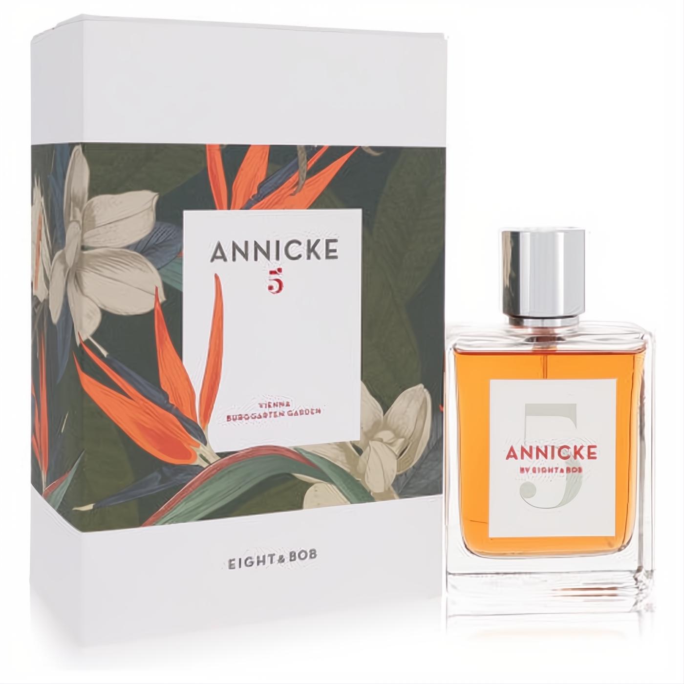 Annicke 5 by Eight & Bob EDP spray. Clear glass bottle with warm orange liquid, silver cap, and a stunning tropical floral box.