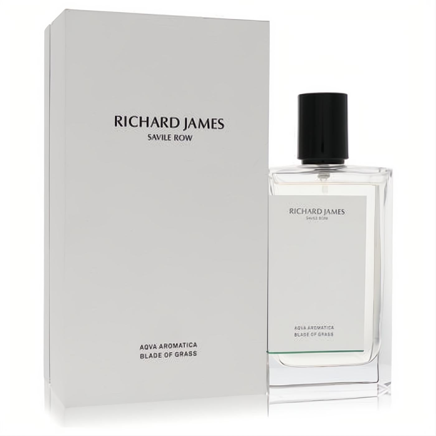 Richard James Aqua Aromatica Blade of Grass cologne. Elegant clear glass bottle with black cap and subtle green detail, beside its white box.
