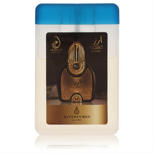 Discover Arabiyat Prestige Aariz Intense .67 oz mini EDP spray. Features a sleek translucent white bottle, vibrant blue cap, and luxurious gold label.