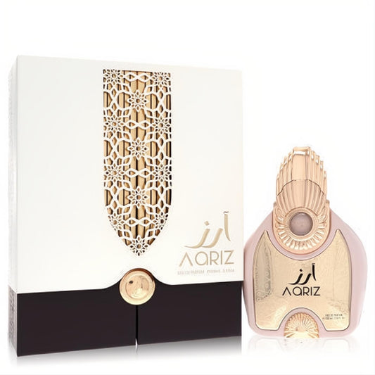 Elegant Arabiyat Prestige Aariz 3.4 oz unisex EDP. Features a stunning pink and gold bottle with an ornate white and gold gift box.