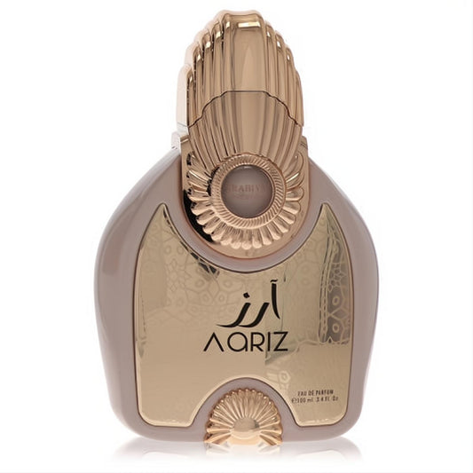 Luxurious Arabiyat Prestige Aariz 3.4 oz EDP. Distinctive taupe bottle with ornate rose gold cap and metallic 'AARIZ' panel.