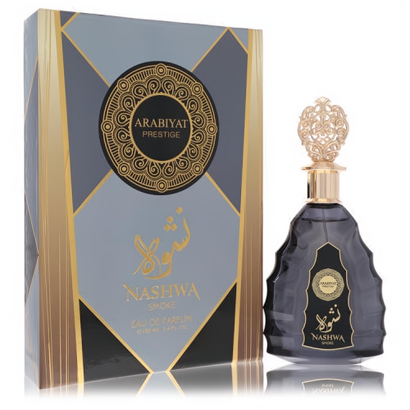 Exquisite Arabiyat Prestige Nashwa Smoke 3.4 oz unisex EDP. Dark gray bottle, ornate gold cap, and elegant geometric box.