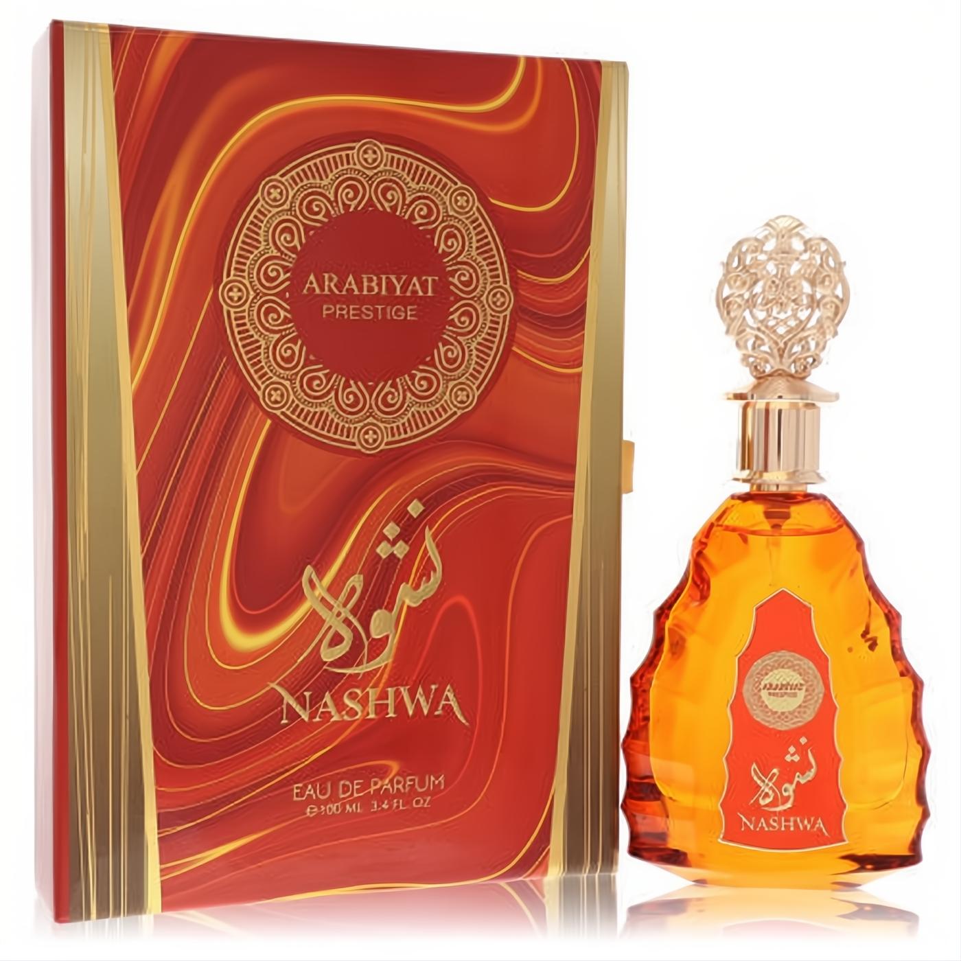 Arabiyat Prestige Nashwa 3.4 oz EDP. Amber fragrance in a distinctive bottle with ornate gold cap, beside a luxurious red and gold box.