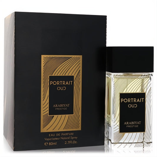 Elegant Arabiyat Prestige Portrait Oud unisex Eau De Parfum, 2.7 oz. Clear glass bottle and sophisticated black, gold-patterned box.