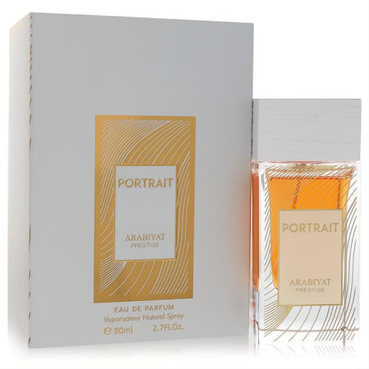 Arabiyat Prestige Portrait 2.7 oz unisex EDP spray. Clear bottle showcasing warm amber liquid, elegant white box with gold accents.