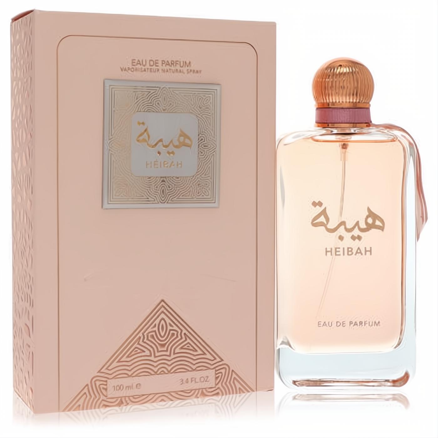 Luxurious Ard Al Zaafaran Heibah 3.4 oz EDP. Peach-tinted glass bottle with gold cap, pink ribbon, and elegant matching box.