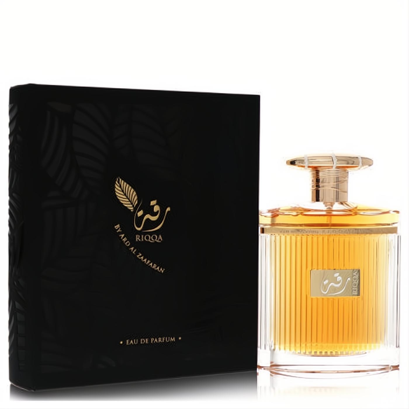 Luxurious Ard Al Zaafaran Riqqa unisex Eau De Parfum. Ribbed glass bottle with golden amber liquid and a sleek black and gold box.