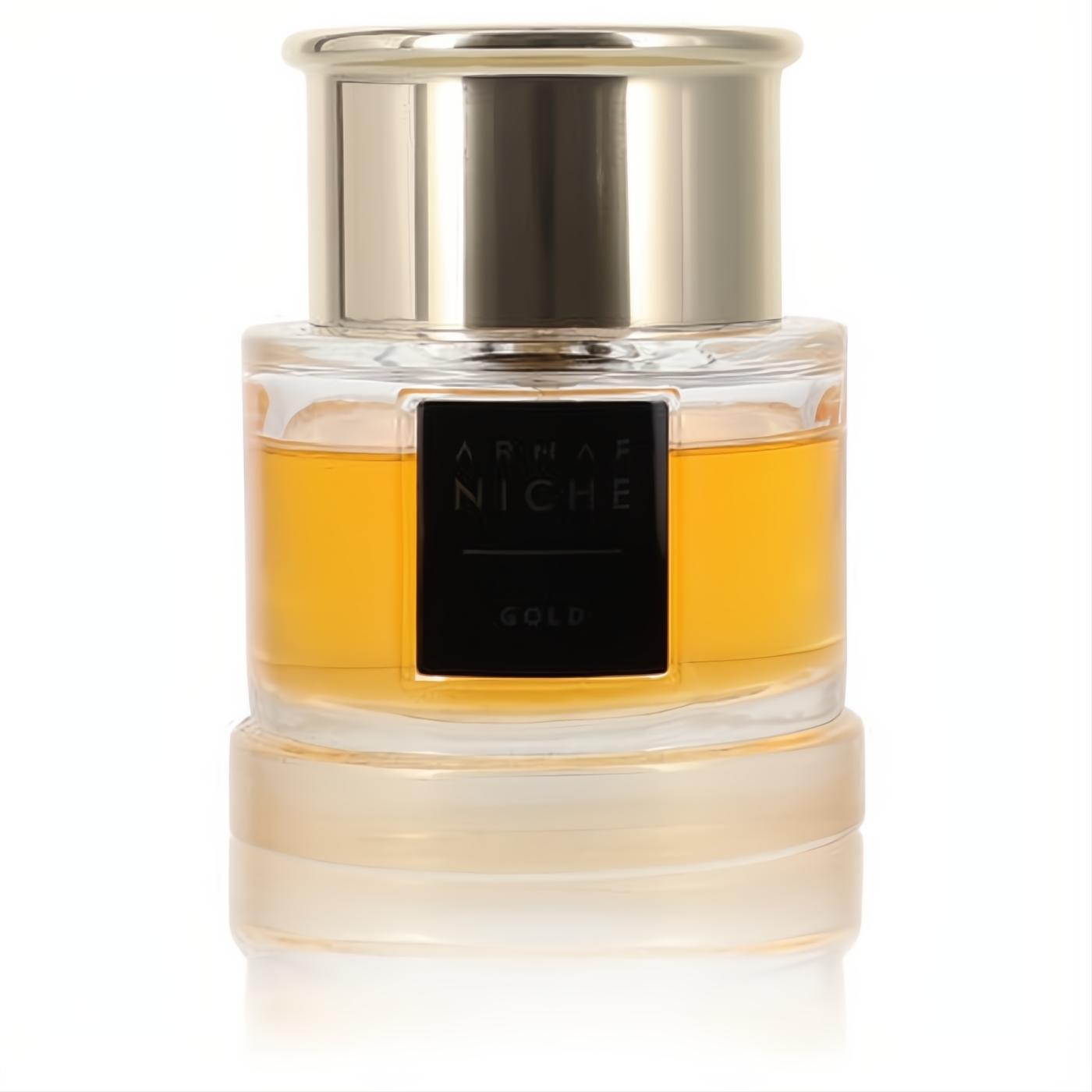 Armaf Niche Gold women's perfume in a clear glass bottle with radiant golden liquid, sleek black label, and polished gold cap.