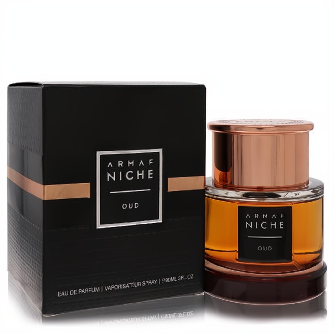 Armaf Niche Oud 3 oz EDP: amber liquid in a clear bottle, crowned with a luxurious rose gold cap, beside its sleek black and gold box.