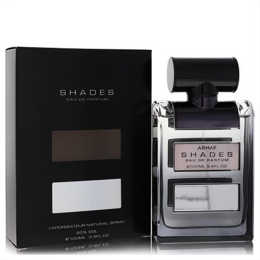 Armaf Shades 3.4 oz men's EDP. Sleek clear glass bottle with a black cap and silver accents, next to its sophisticated black box.