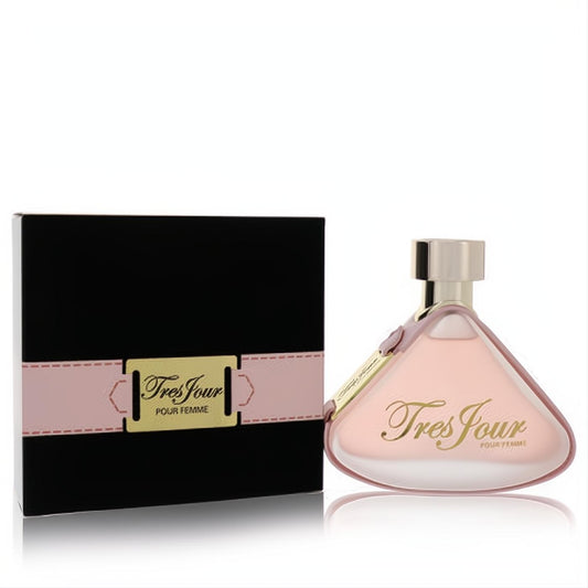 Armaf Tres Jour Pour Femme perfume in a chic pink triangular bottle with gold cap, next to its elegant black box with a pink ribbon and gold plate.