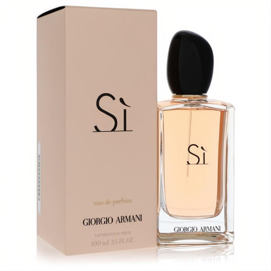 Giorgio Armani Sì Eau De Parfum 3.4 oz. Elegant clear bottle with black cap, peach liquid, and nude box.