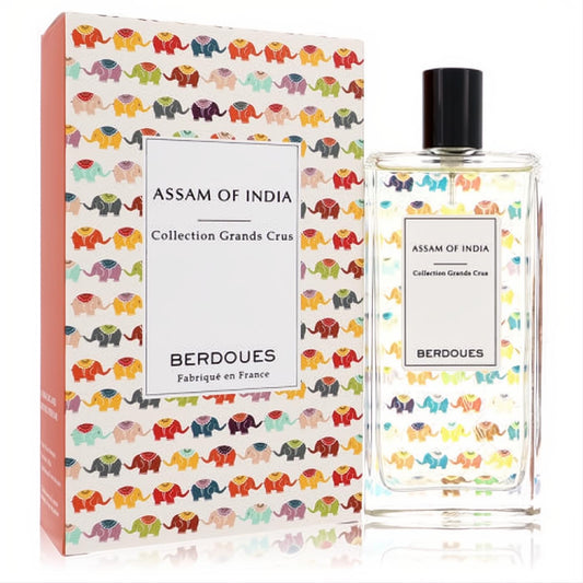 Berdoues Assam of India 3.38 oz EDP spray, a sleek clear bottle with black cap, next to its vibrant elephant-patterned box.