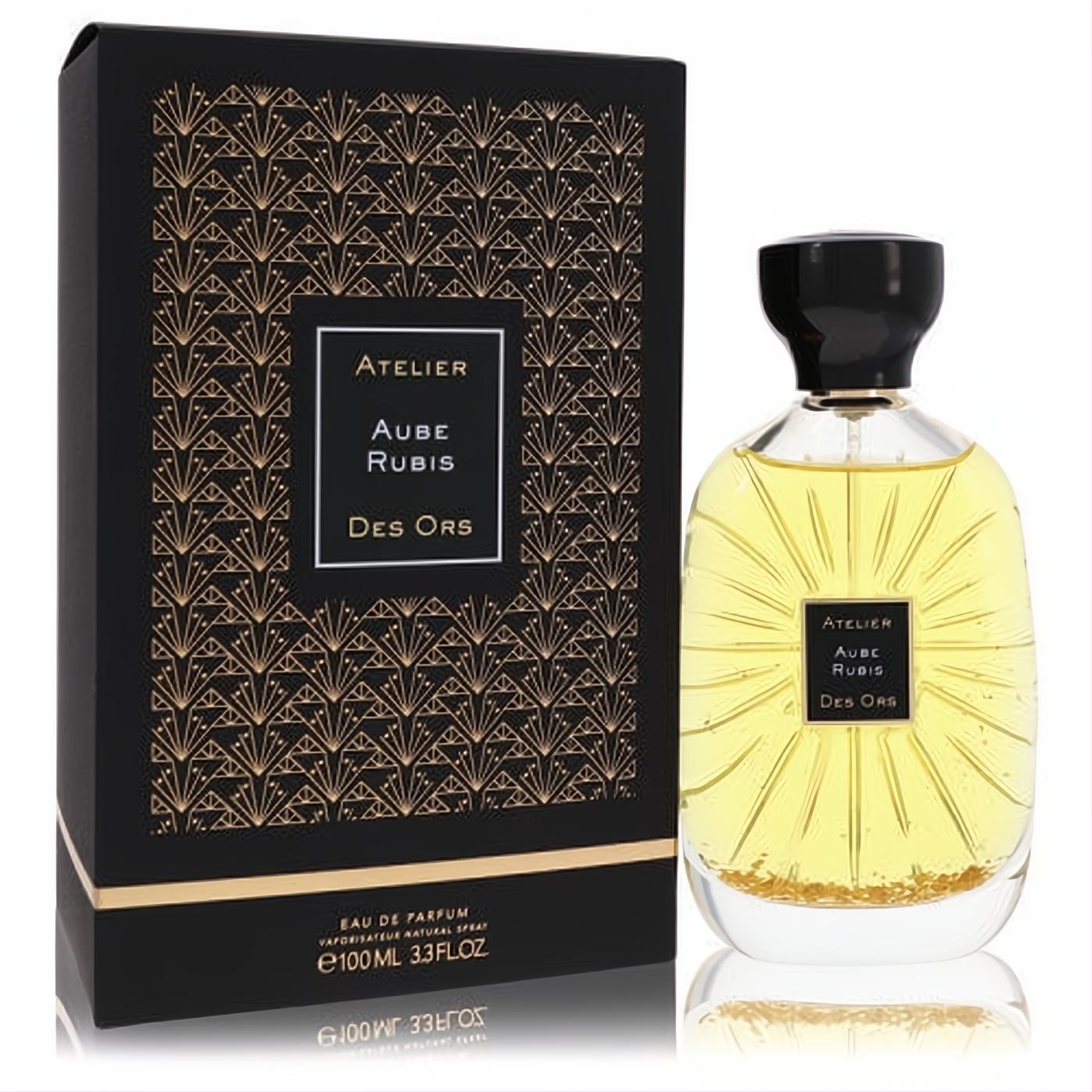 Luxurious Aube Rubis Des Ors 3.3 oz unisex Eau De Parfum. Golden liquid in clear bottle with black cap and elegant art deco box.