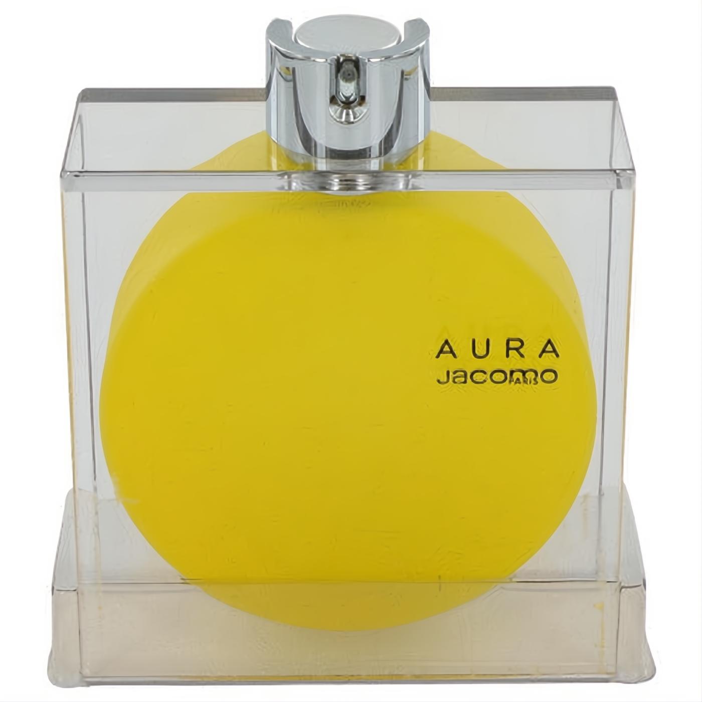 Vibrant yellow Aura by Jacomo women's perfume bottle with a silver sprayer, elegantly presented in a clear display case.