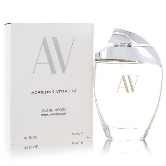 Av by Adrienne Vittadini 3 oz Eau De Parfum. Elegant clear glass bottle, sculpted silver cap, and white branded box.