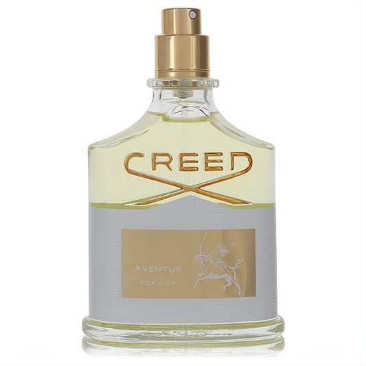 Luxurious Aventus by Creed Eau De Parfum for Her, 2.5 oz tester. Clear glass bottle with gold sprayer, silver label, and equestrian logo.