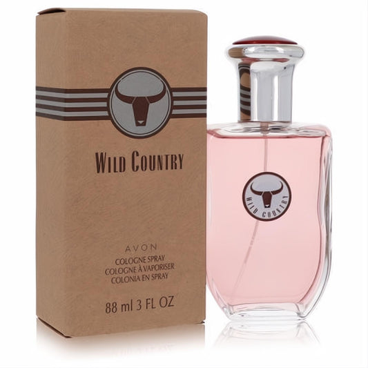 Avon Wild Country 3 oz men's cologne spray. Clear glass bottle with pink liquid, silver cap, and bull logo. Rustic brown box.