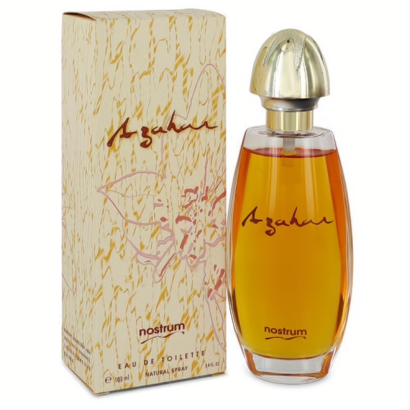 Azahar by Nostrum 3.4 oz Eau De Toilette. Clear bottle with radiant amber liquid, elegant gold cap, and decorative floral box.